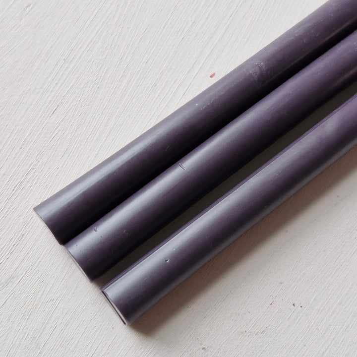 Detailed view of plum 11mm sealing wax sticks, part of a 10-pack for sealing and decorative purposes in office supplies.